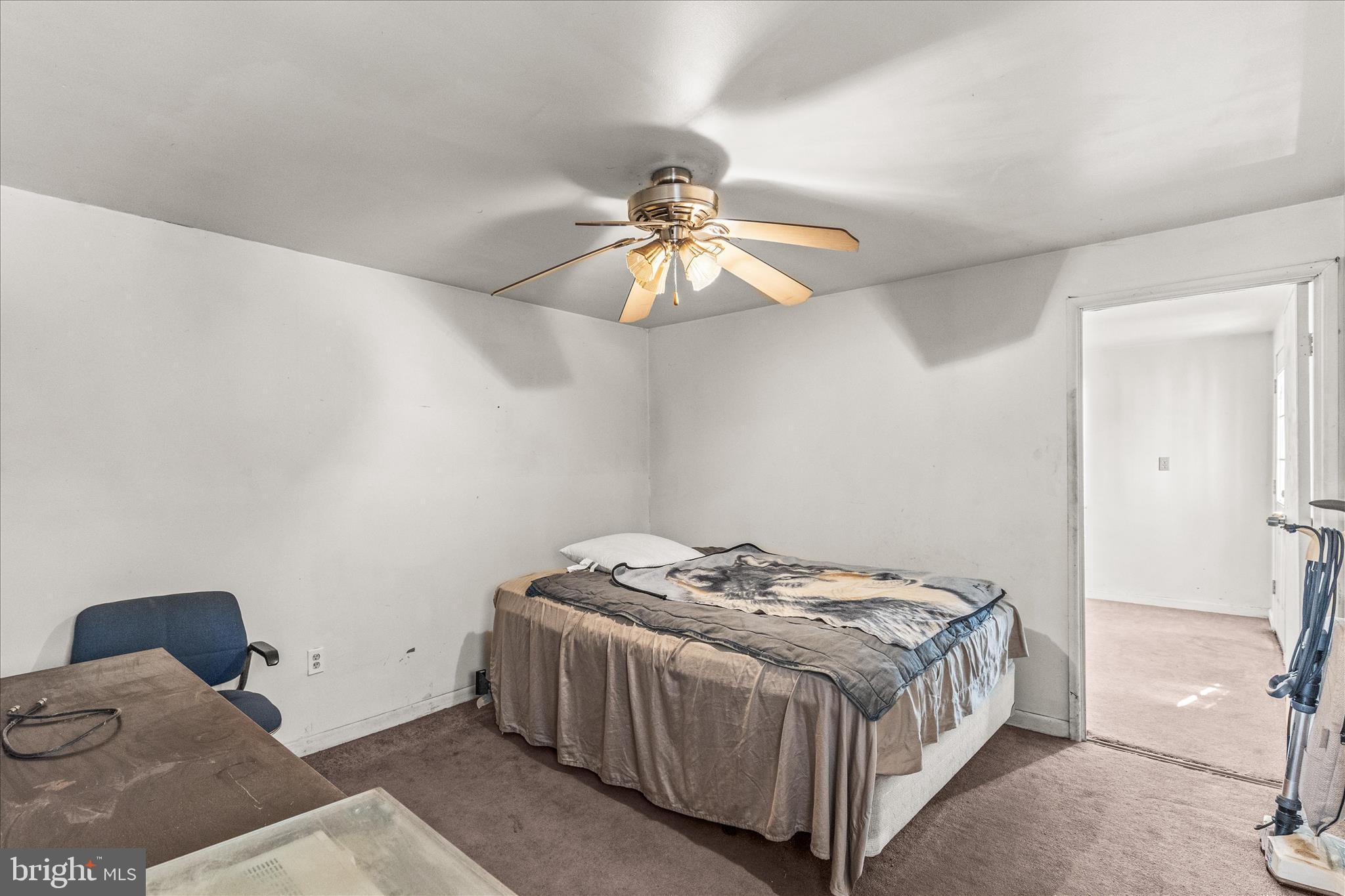 2219 Lodge Farm Road Sparrows Point, MD 21219 - Photo 15 of 36 a bedroom with a bed and a chandelier