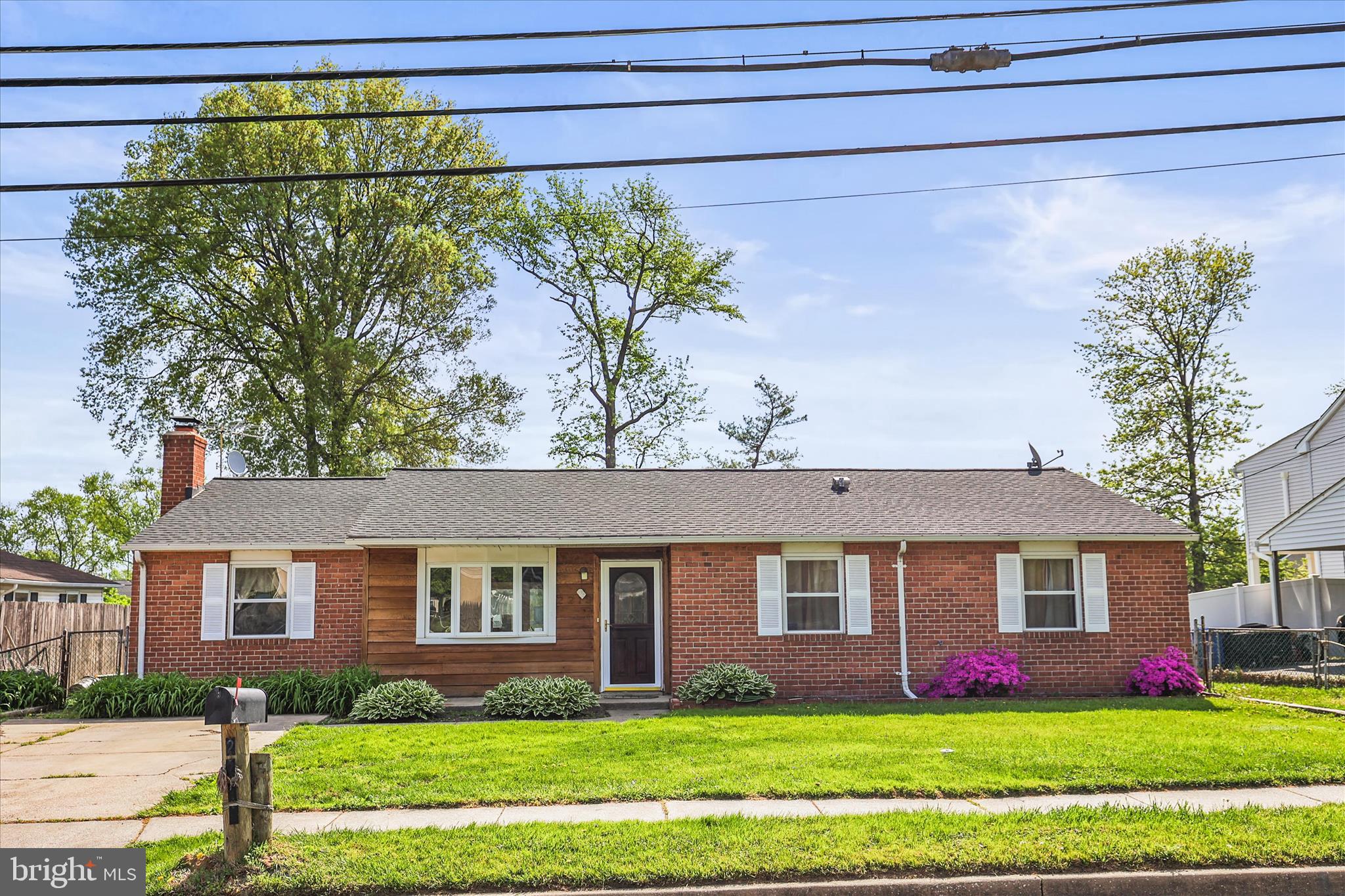 2219 Lodge Farm Road Sparrows Point, MD 21219 - Photo 2 of 36 a front view of house with yard and green space