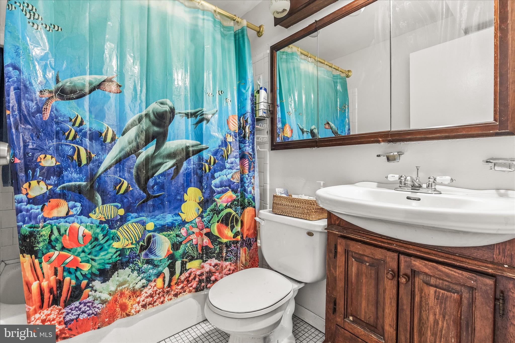 2219 Lodge Farm Road Sparrows Point, MD 21219 - Photo 22 of 36 a bathroom with a toilet sink and mirror