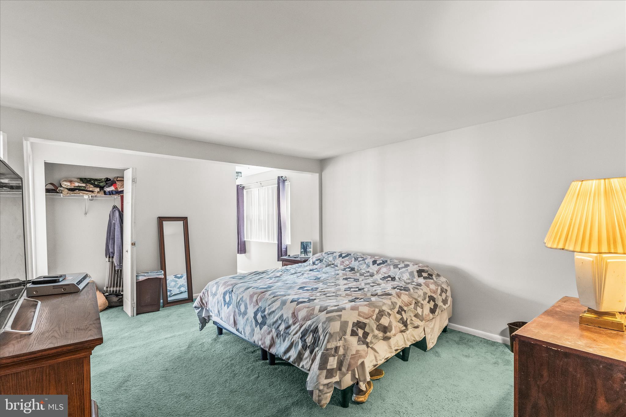 2219 Lodge Farm Road Sparrows Point, MD 21219 - Photo 23 of 36 a bedroom with a bed dresser and a lamp