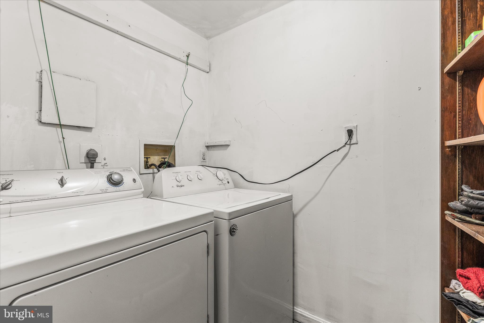 2219 Lodge Farm Road Sparrows Point, MD 21219 - Photo 25 of 36 a utility room with dryer and washer