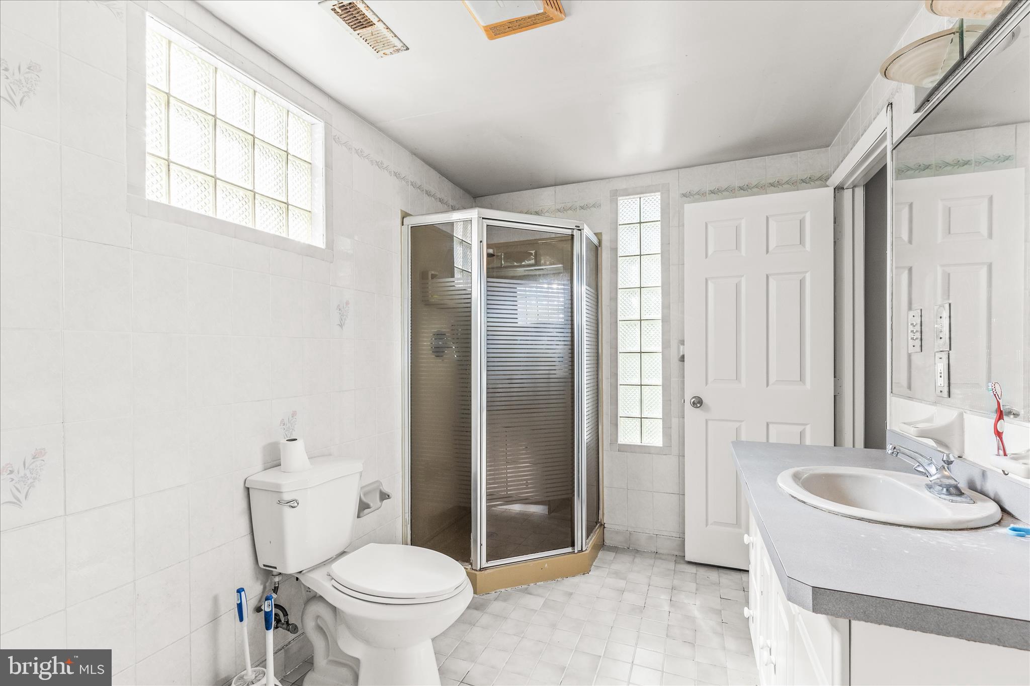 2219 Lodge Farm Road Sparrows Point, MD 21219 - Photo 27 of 36 a bathroom with a sink toilet and shower