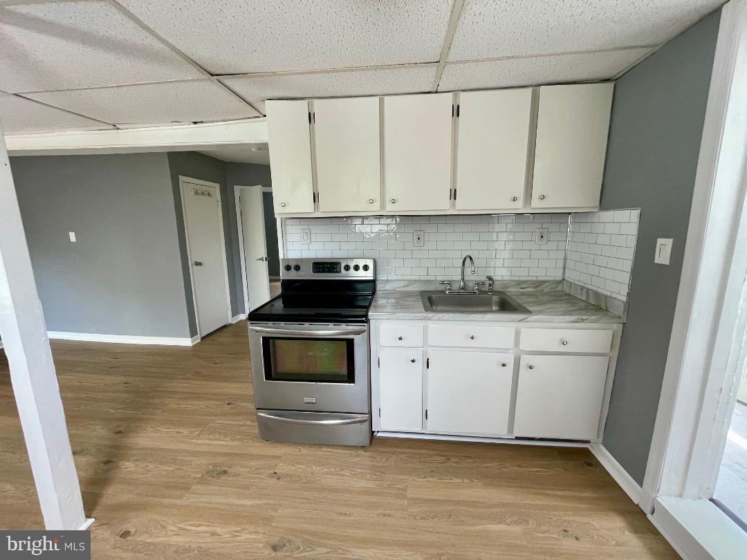 904-906 Main Avenue Croydon, PA 19021 - Photo 27 of 51 a kitchen with stainless steel appliances granite countertop a stove a sink and a refrigerator