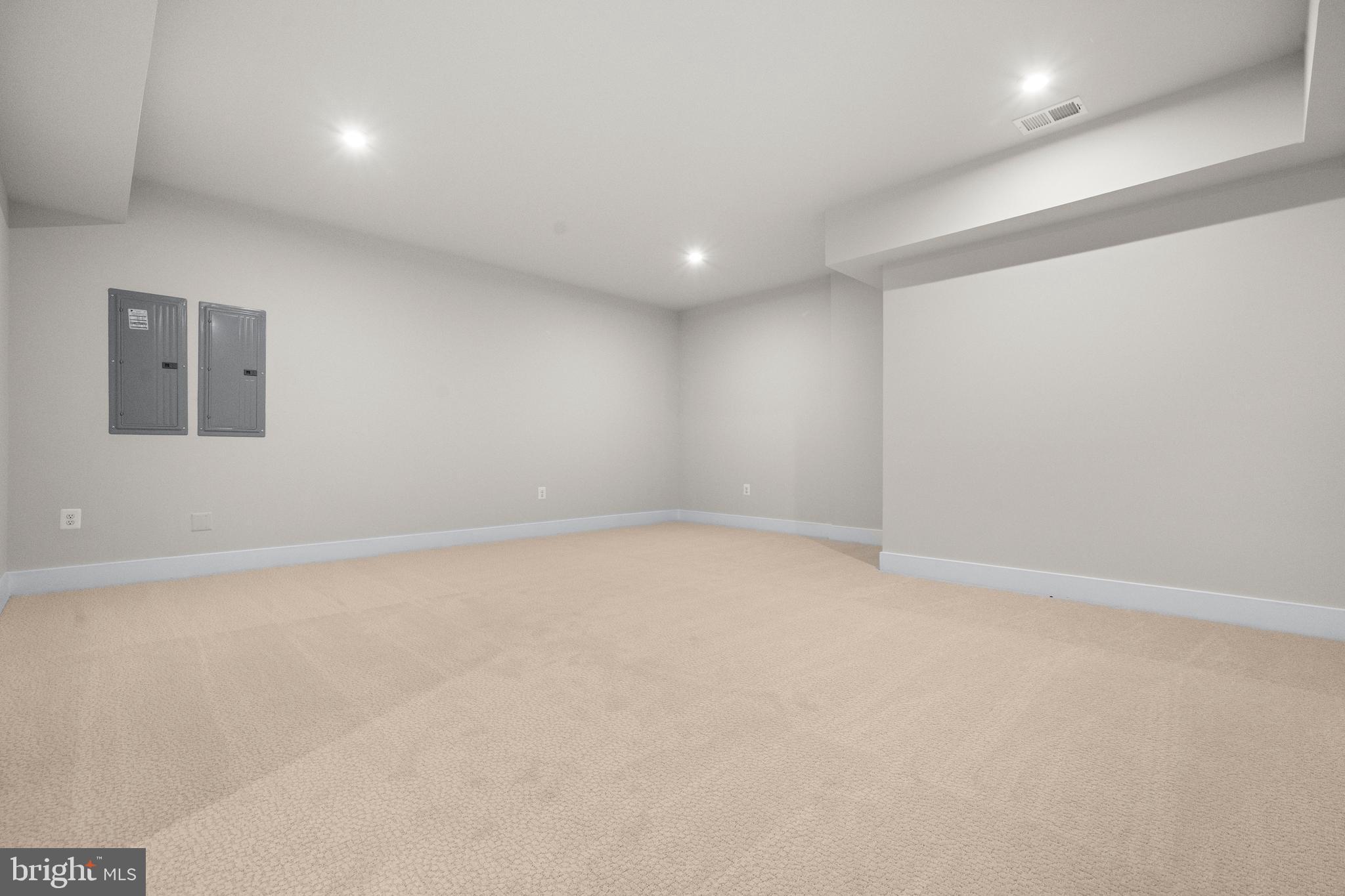 7505 Magarity Road Falls Church, VA 22043 - Photo 57 of 69 an empty room with a natural light