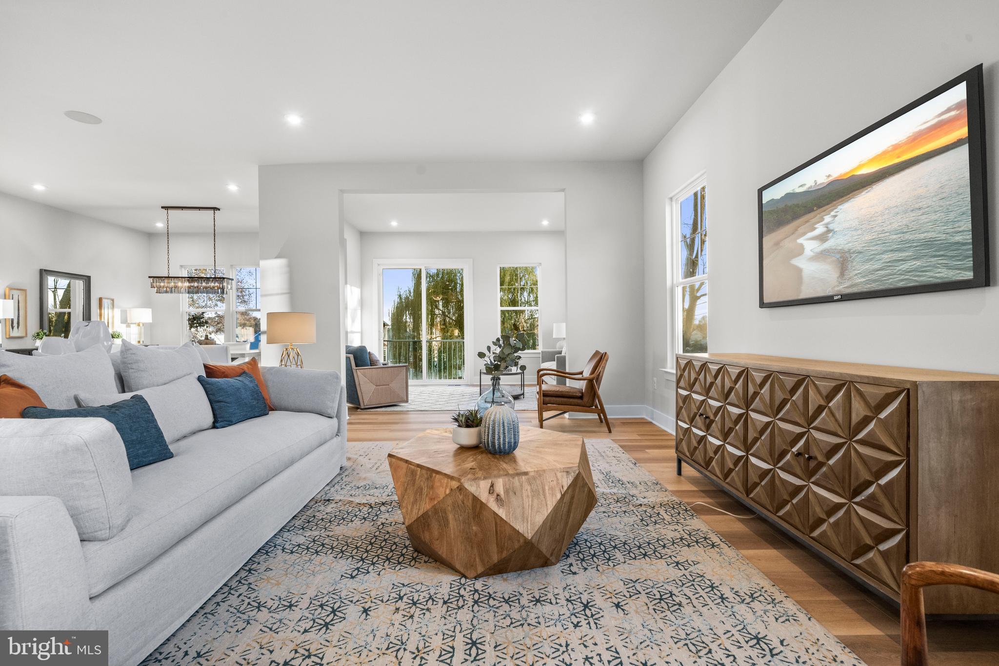 7505 Magarity Road Falls Church, VA 22043 - Photo 7 of 69 a living room with furniture and a flat screen tv