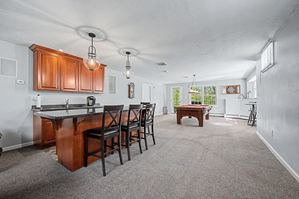 270 Mendon Road Sutton, MA 01590 - Photo 32 of 42 a room with furniture a air conditioner vent and a window