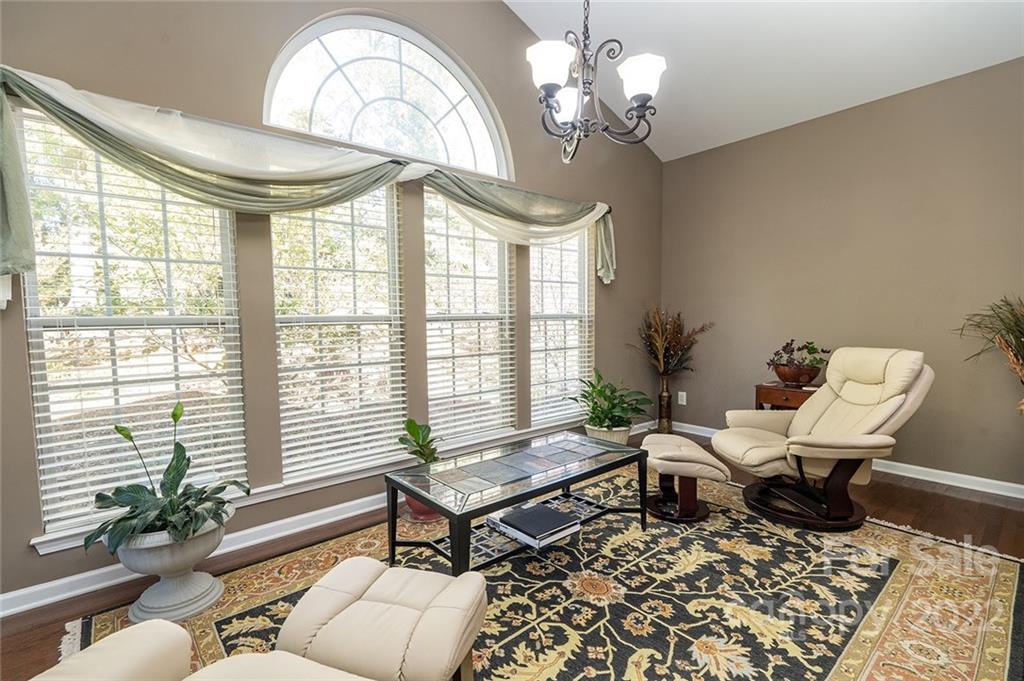 225 Fischer Road Fort Mill, SC 29715 - Photo 11 of 32 a living room with furniture and a chandelier