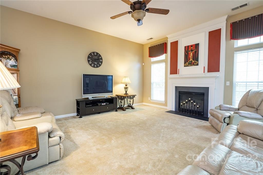 225 Fischer Road Fort Mill, SC 29715 - Photo 13 of 32 a living room with furniture and a fireplace