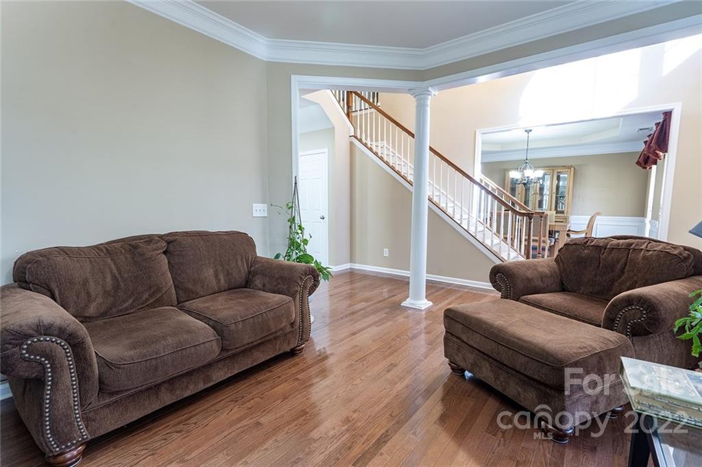 225 Fischer Road Fort Mill, SC 29715 - Photo 16 of 32 a living room with furniture and a wooden floor