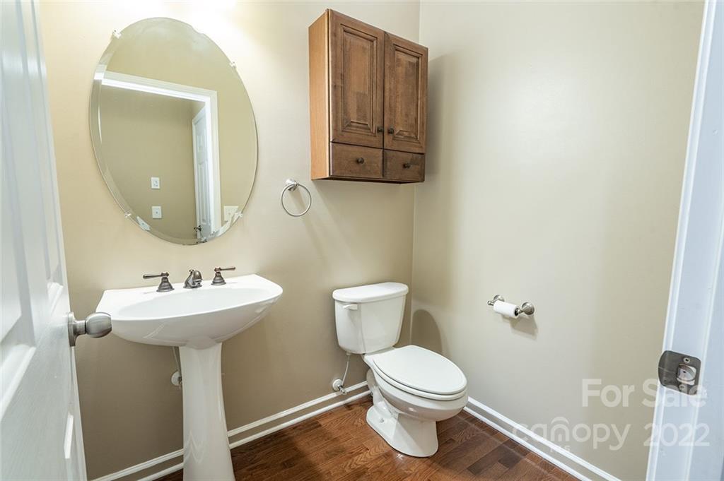225 Fischer Road Fort Mill, SC 29715 - Photo 17 of 32 a bathroom with a toilet sink and mirror