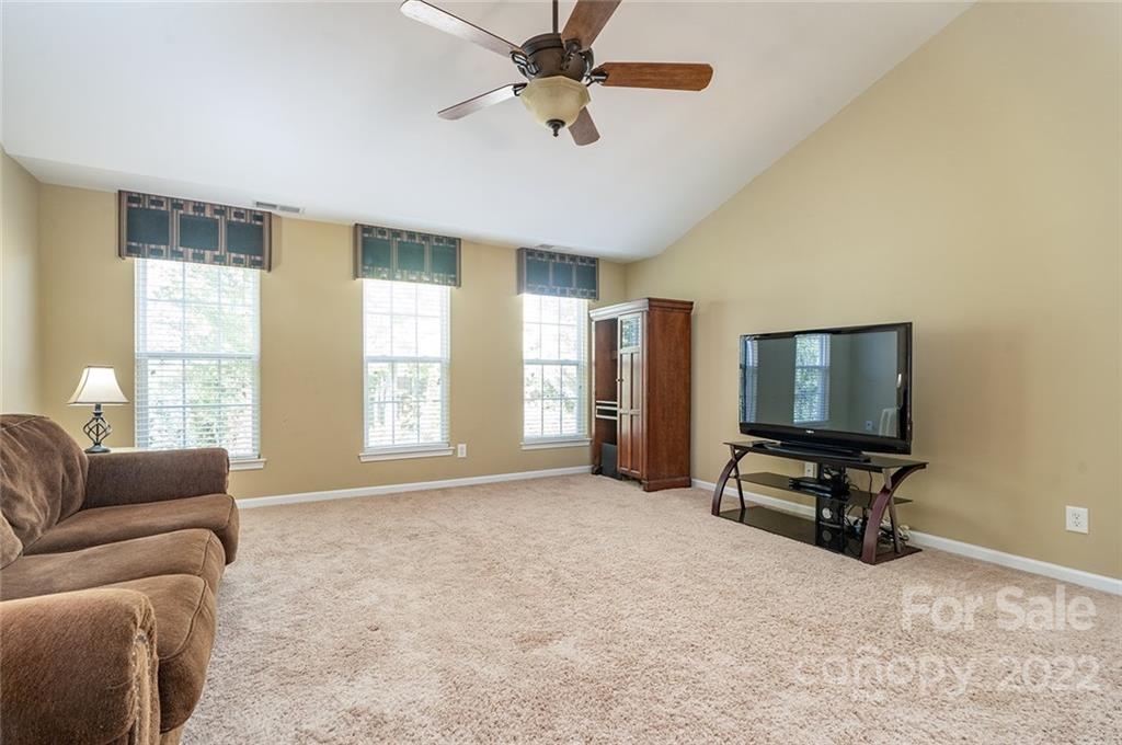 225 Fischer Road Fort Mill, SC 29715 - Photo 19 of 32 a living room with furniture and a flat screen tv