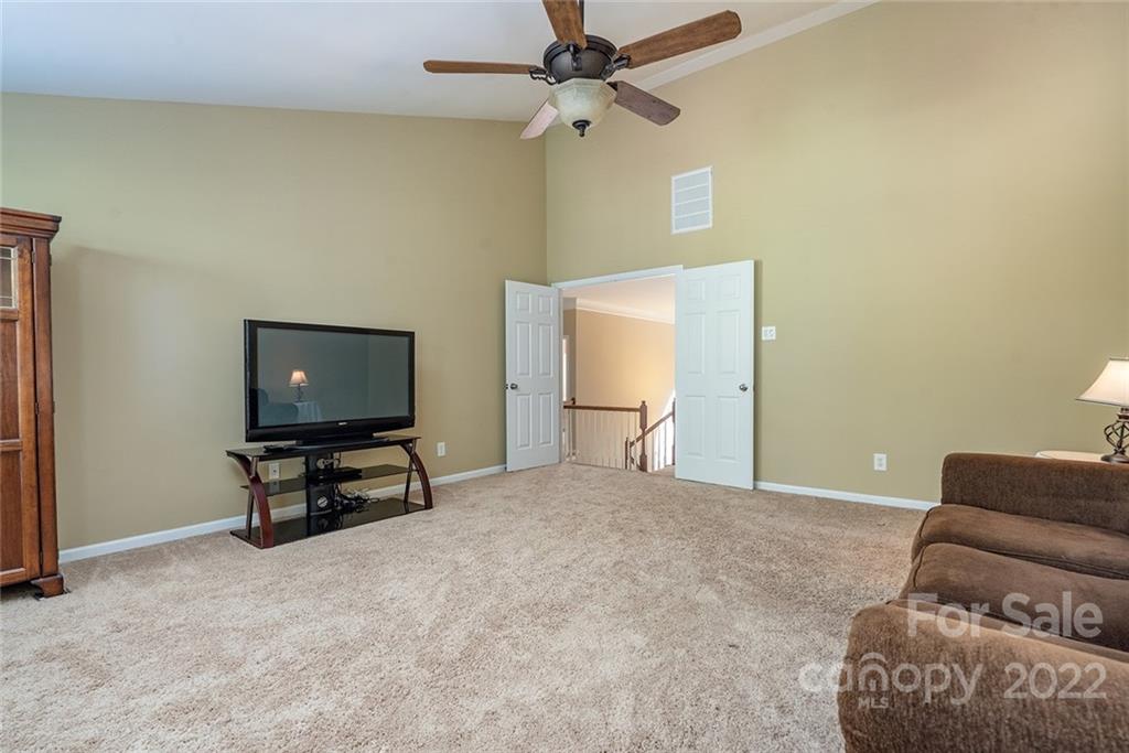 225 Fischer Road Fort Mill, SC 29715 - Photo 20 of 32 a bedroom with furniture and a flat screen tv