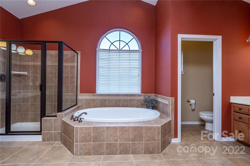 225 Fischer Road Fort Mill, SC 29715 - Photo 24 of 32 a bathroom with a bathtub and a toilet