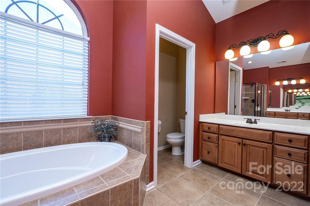 225 Fischer Road Fort Mill, SC 29715 - Photo 25 of 32 a bathroom with a bathtub and a sink
