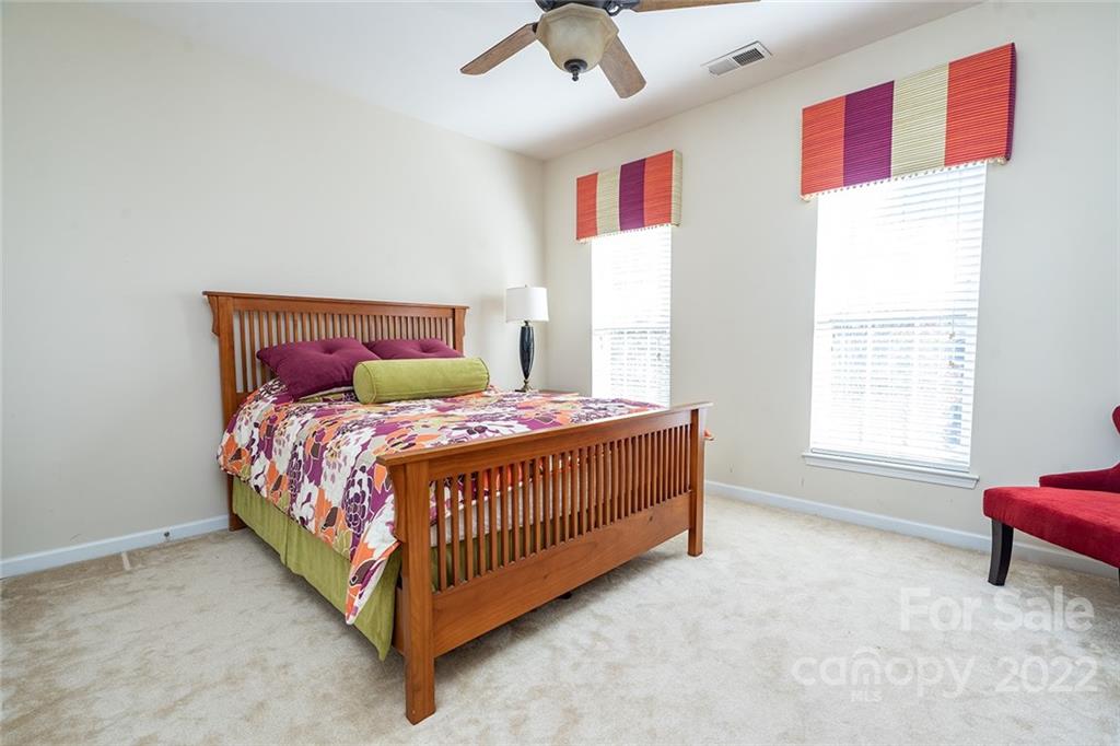 225 Fischer Road Fort Mill, SC 29715 - Photo 26 of 32 a bed sitting in a bedroom next to a window
