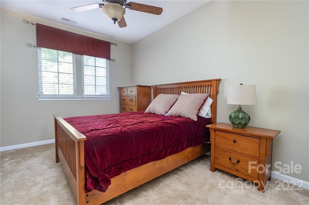 225 Fischer Road Fort Mill, SC 29715 - Photo 27 of 32 a bed room with a bed and a dresser