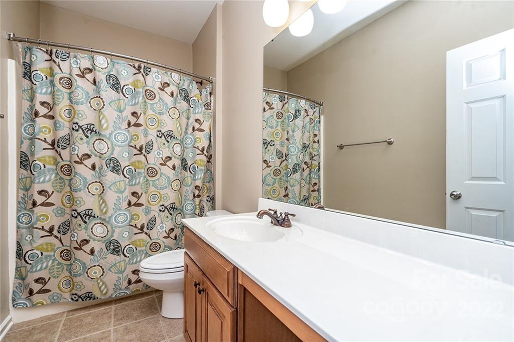 225 Fischer Road Fort Mill, SC 29715 - Photo 28 of 32 a bathroom with a sink toilet and shower