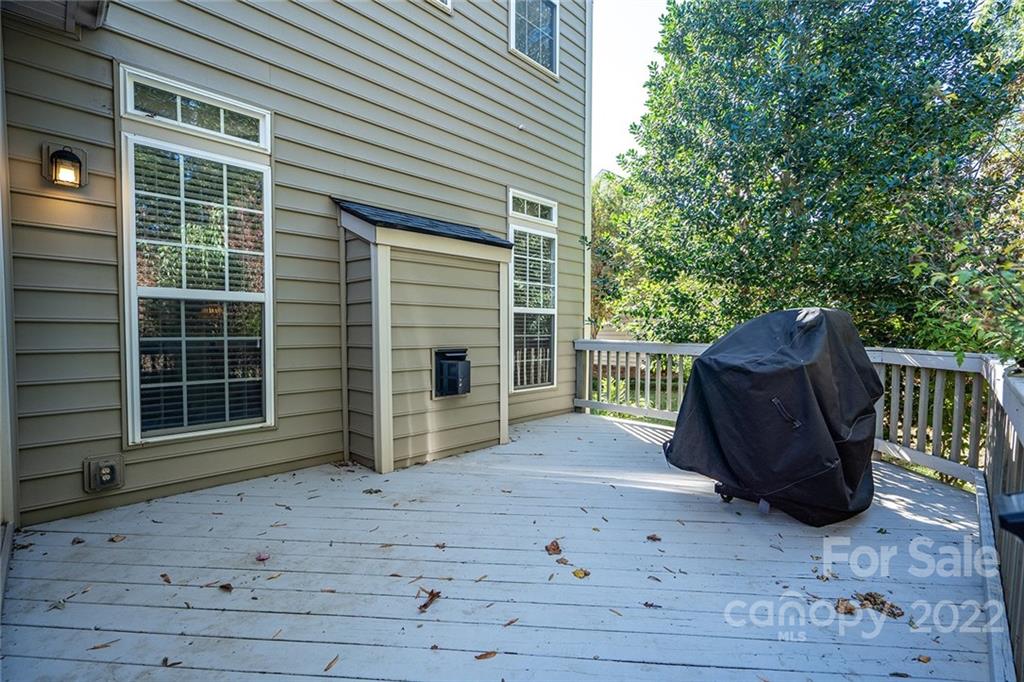 225 Fischer Road Fort Mill, SC 29715 - Photo 31 of 32 a view of a house with a door and wooden bench