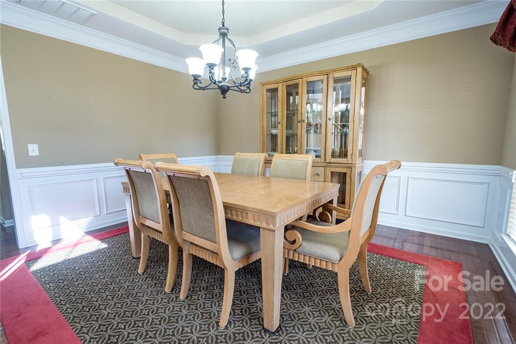 225 Fischer Road Fort Mill, SC 29715 - Photo 4 of 32 a view of a dining room with furniture and chandelier