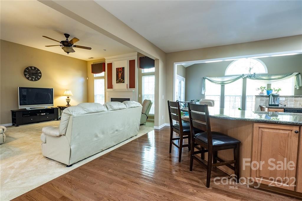 225 Fischer Road Fort Mill, SC 29715 - Photo 8 of 32 a living room with furniture a flat screen tv and a large window