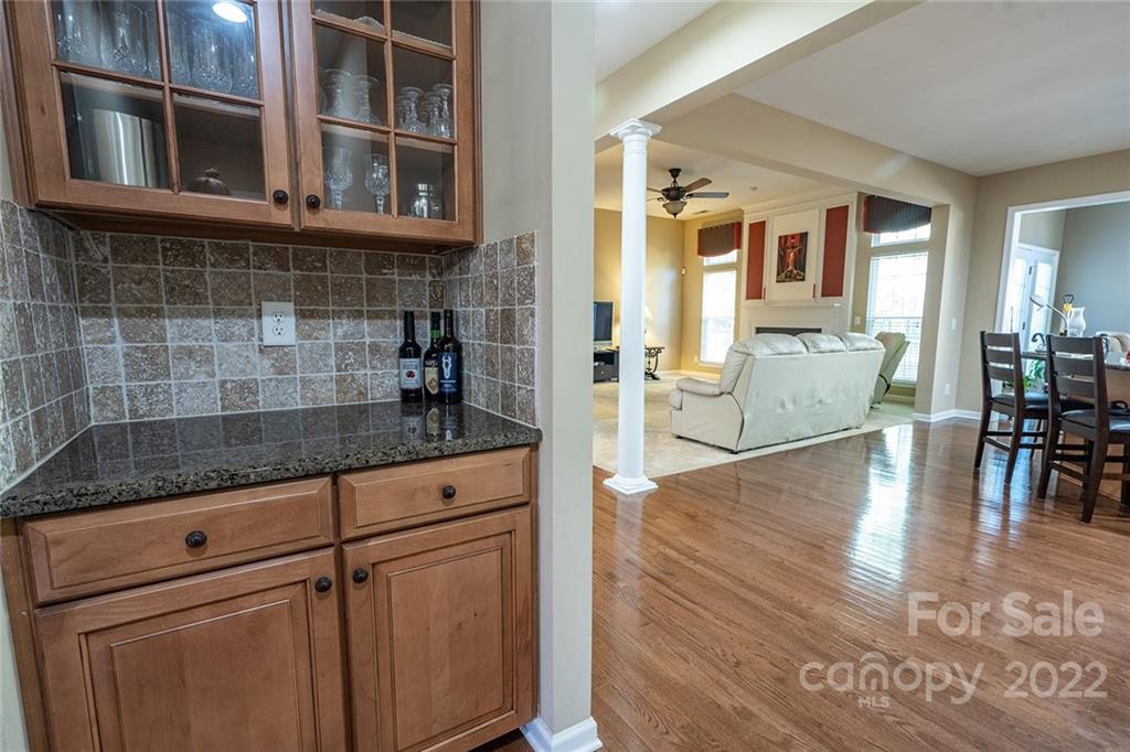 225 Fischer Road Fort Mill, SC 29715 - Photo 9 of 32 a kitchen with granite countertop a stove and cabinets