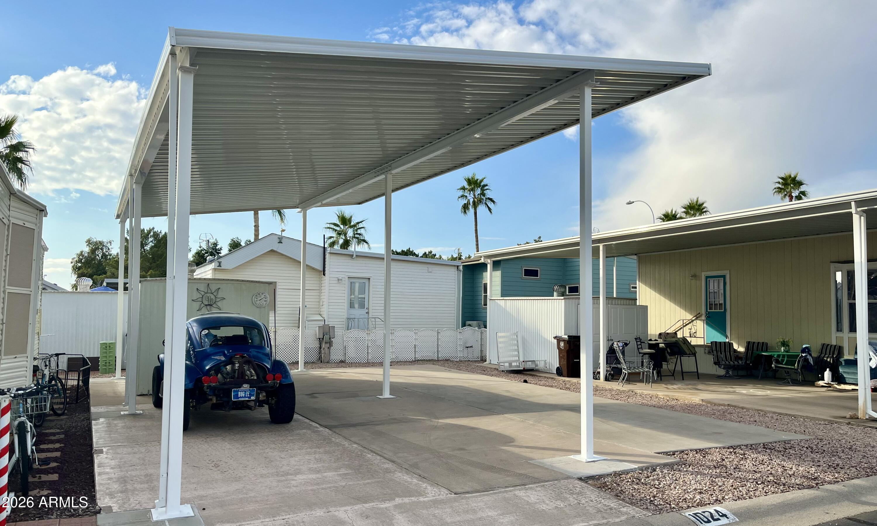 1024 Prospector Drive, Unit 1024 Apache Junction, AZ 85119 - Photo 2 of 40 a view of a car park in front of house
