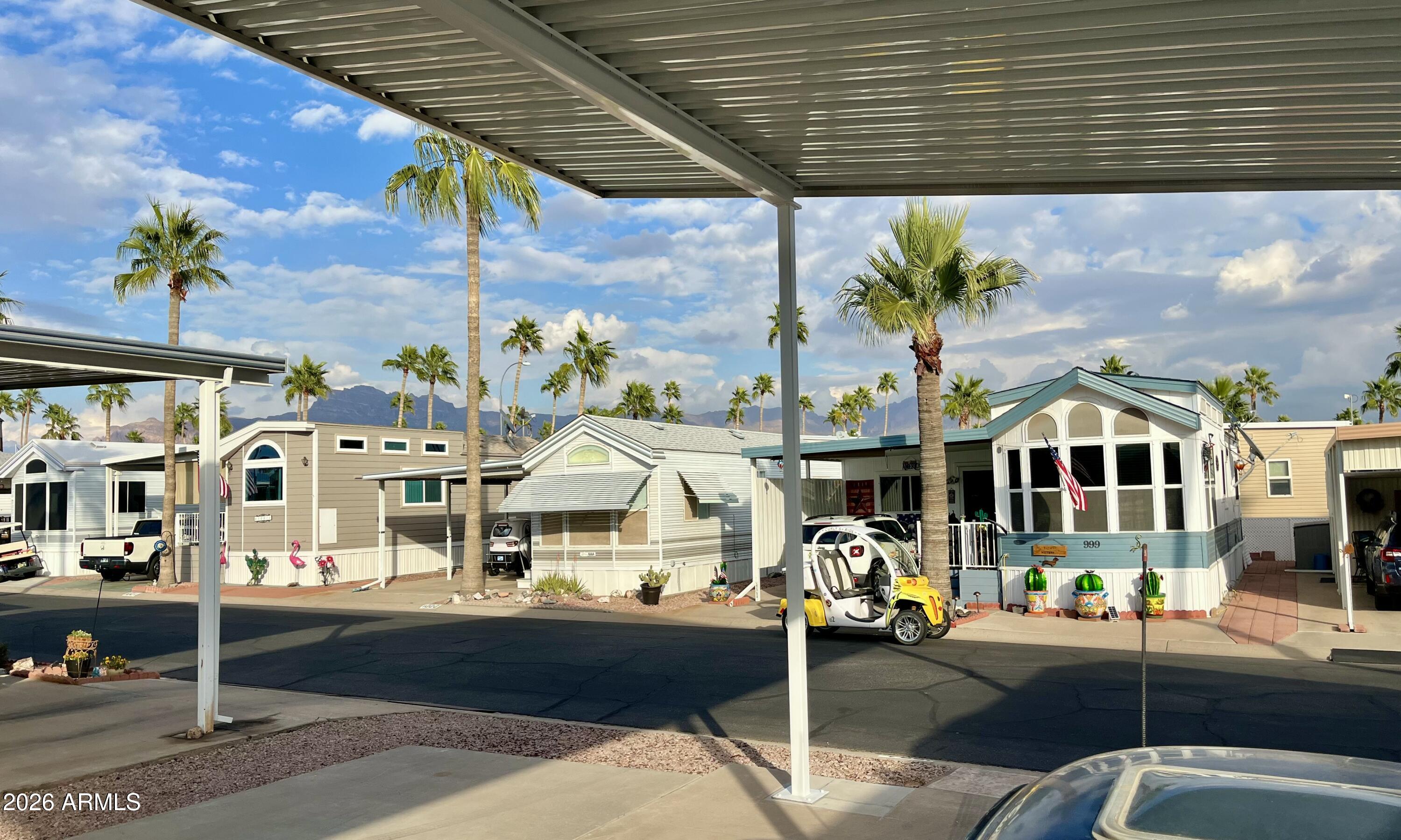 1024 Prospector Drive, Unit 1024 Apache Junction, AZ 85119 - Photo 5 of 40 a front view of a building with street view
