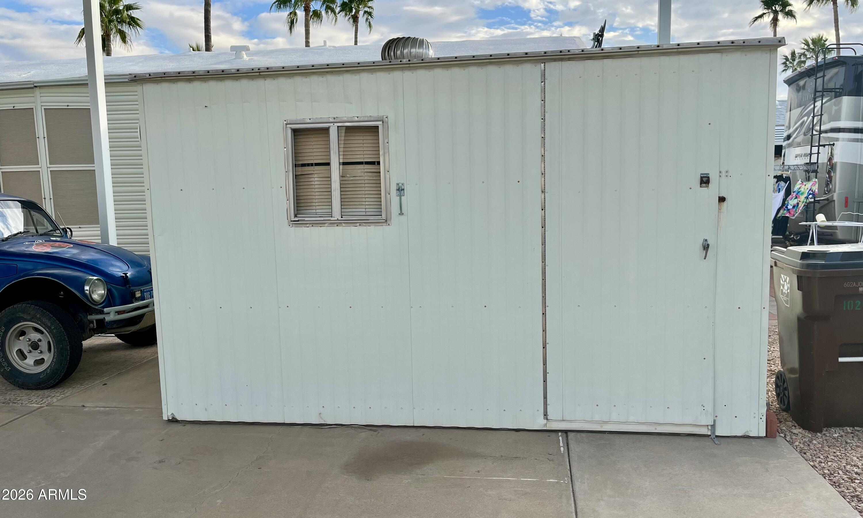1024 Prospector Drive, Unit 1024 Apache Junction, AZ 85119 - Photo 6 of 40 a car parked in front of a house