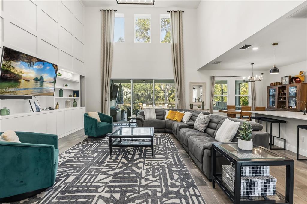 639 Primrose Willow Way Apopka, FL 32712 - Photo 11 of 70 a living room with furniture and a large window