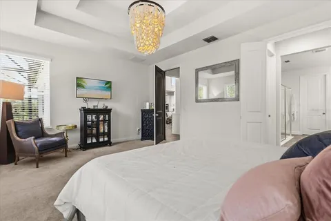 a spacious bathroom with a shower sink and mirror