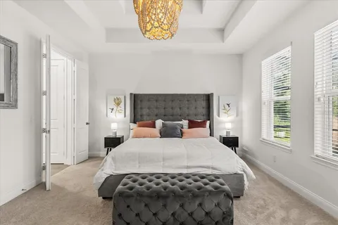 a spacious en suite bathroom with a double vanity sink double and mirror