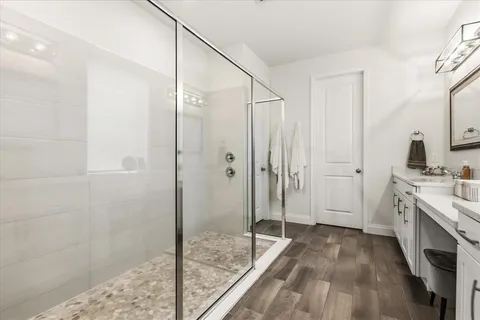 a view of a hallway with a livingroom and stairs