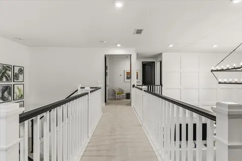 a bathroom with a sink vanity mirror and toilet