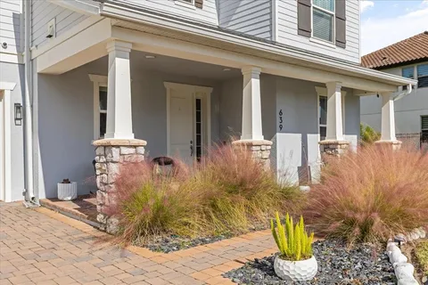 a front view of a house with garden