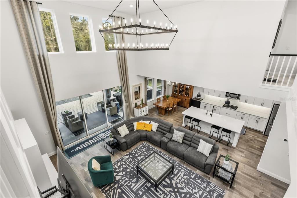 639 Primrose Willow Way Apopka, FL 32712 - Photo 31 of 70 a living room with furniture and a chandelier