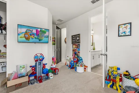 a room with gym equipment and windows