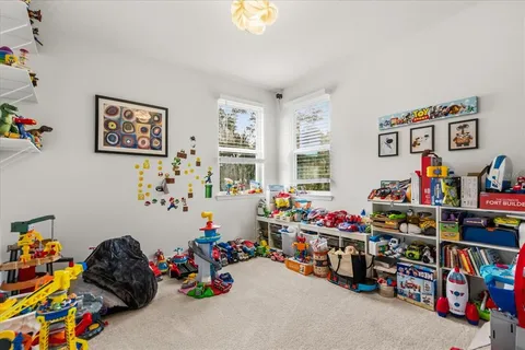 a kitchen with stainless steel appliances granite countertop a stove and a large window