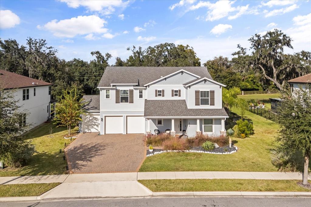 639 Primrose Willow Way Apopka, FL 32712 - Photo 61 of 70 a front view of a house with a garden