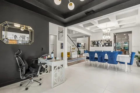 a living room with furniture and a mirror