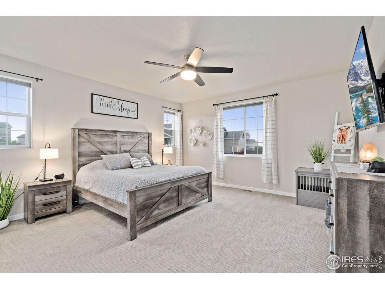2167 First Light Court Windsor, CO 80550 - Photo 14 of 40 a bedroom with a bed and a window