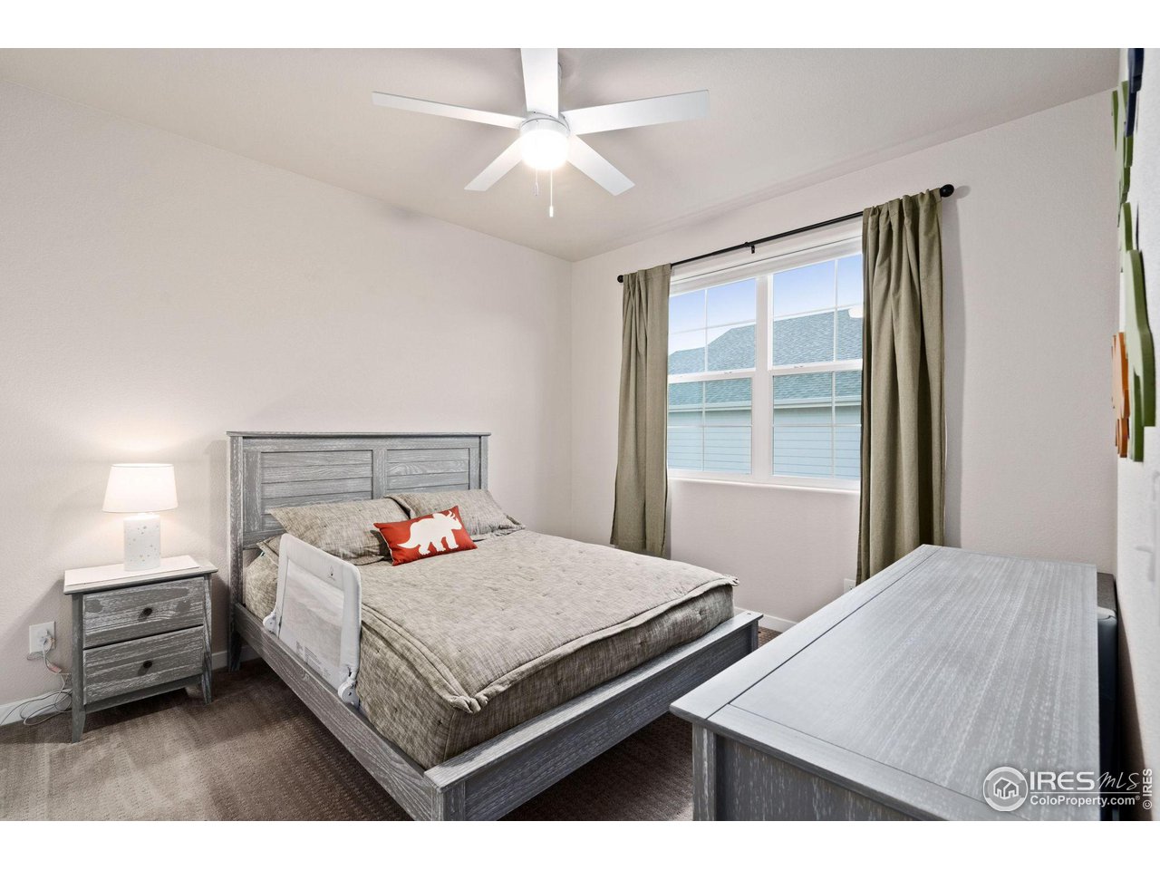 2167 First Light Court Windsor, CO 80550 - Photo 18 of 40 a bedroom with a bed and a window