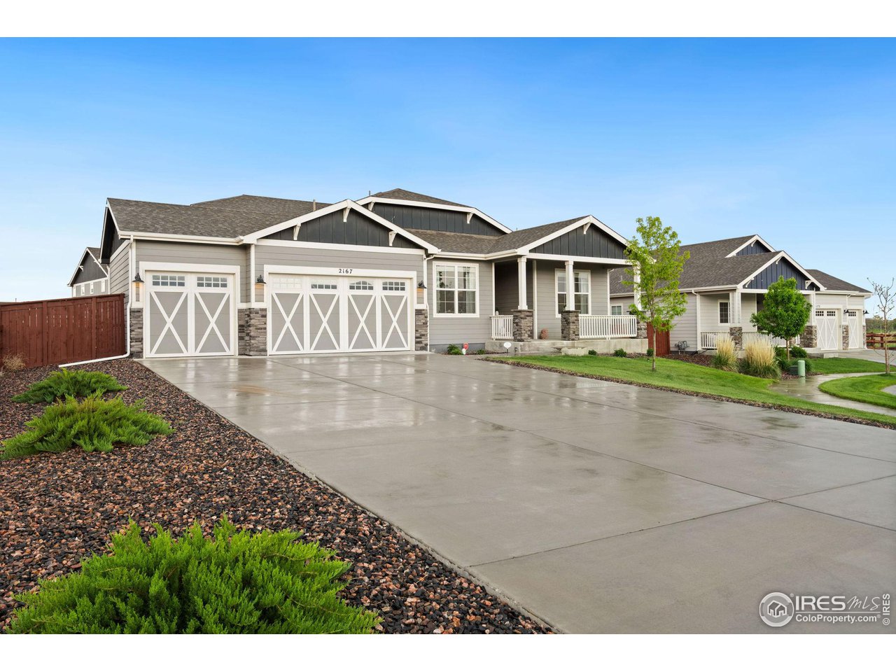 2167 First Light Court Windsor, CO 80550 - Photo 2 of 40 a front view of a house with a yard