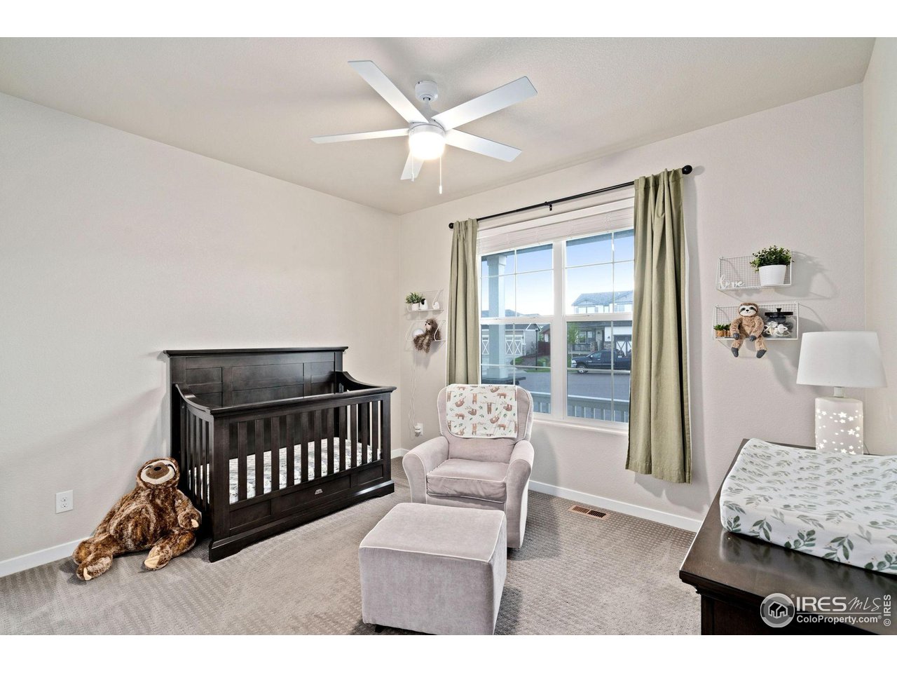 2167 First Light Court Windsor, CO 80550 - Photo 20 of 40 a bedroom with furniture and a window