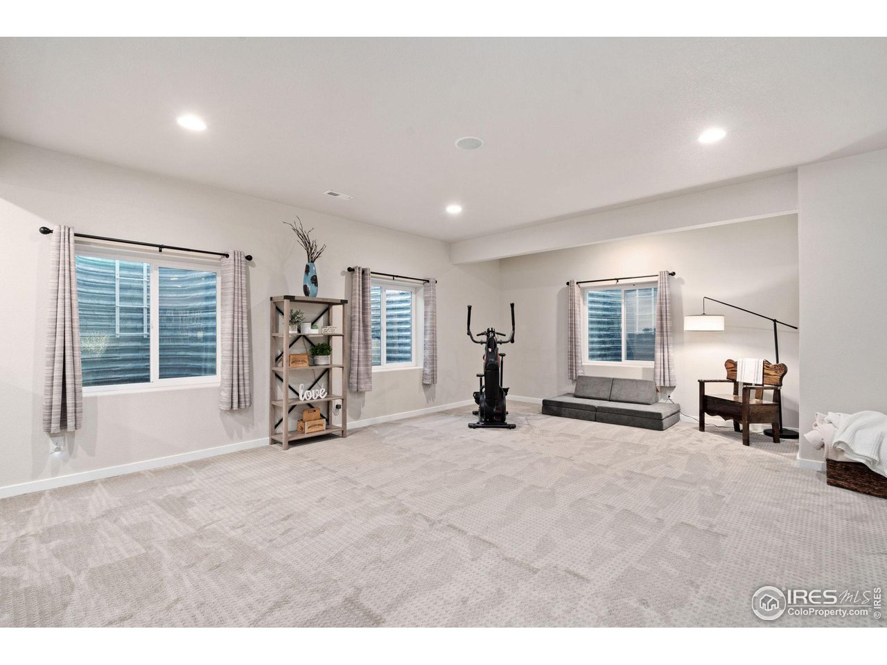 2167 First Light Court Windsor, CO 80550 - Photo 26 of 40 a view of a livingroom with furniture and a window