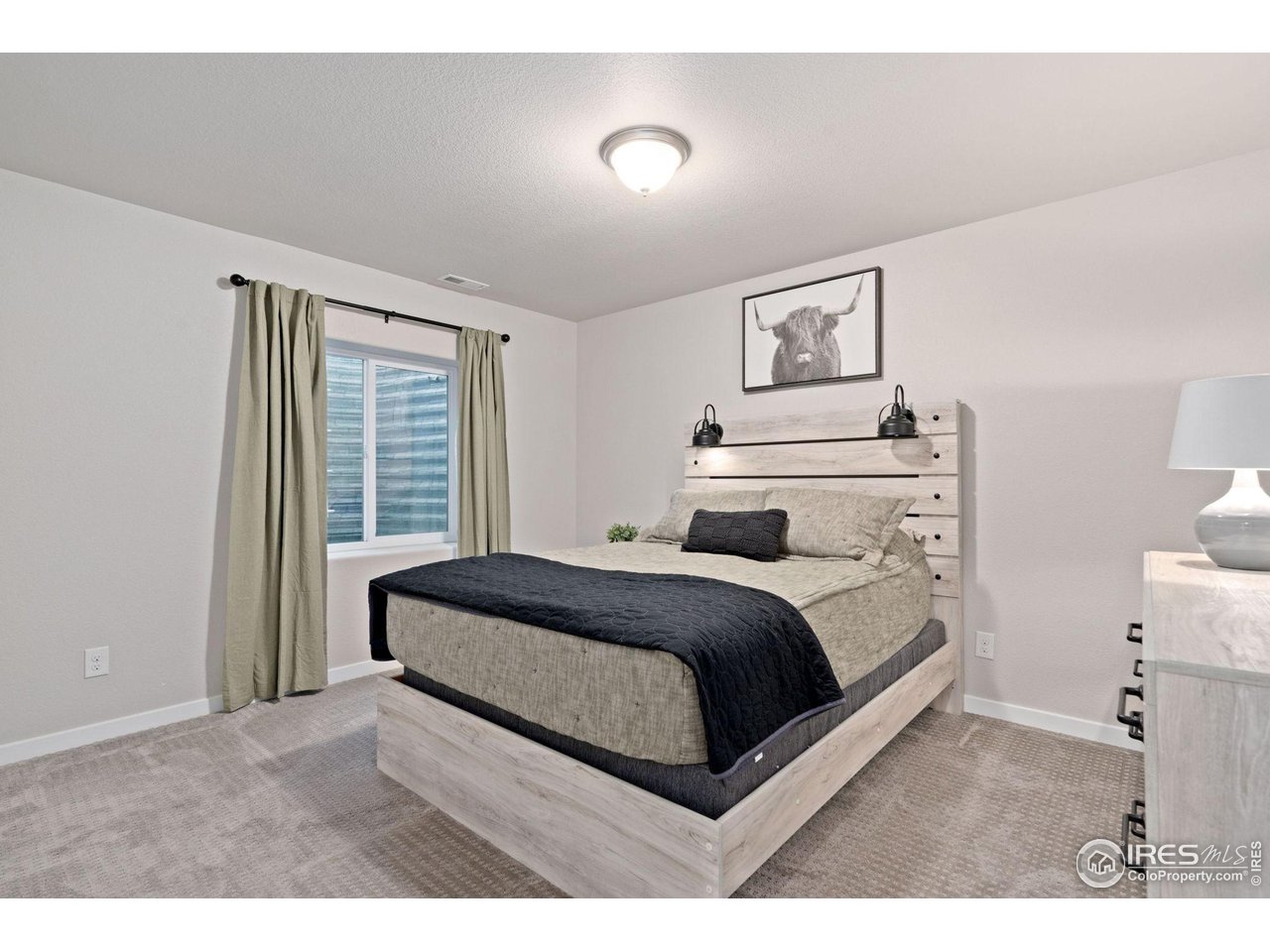 2167 First Light Court Windsor, CO 80550 - Photo 29 of 40 a bedroom with a bed and window
