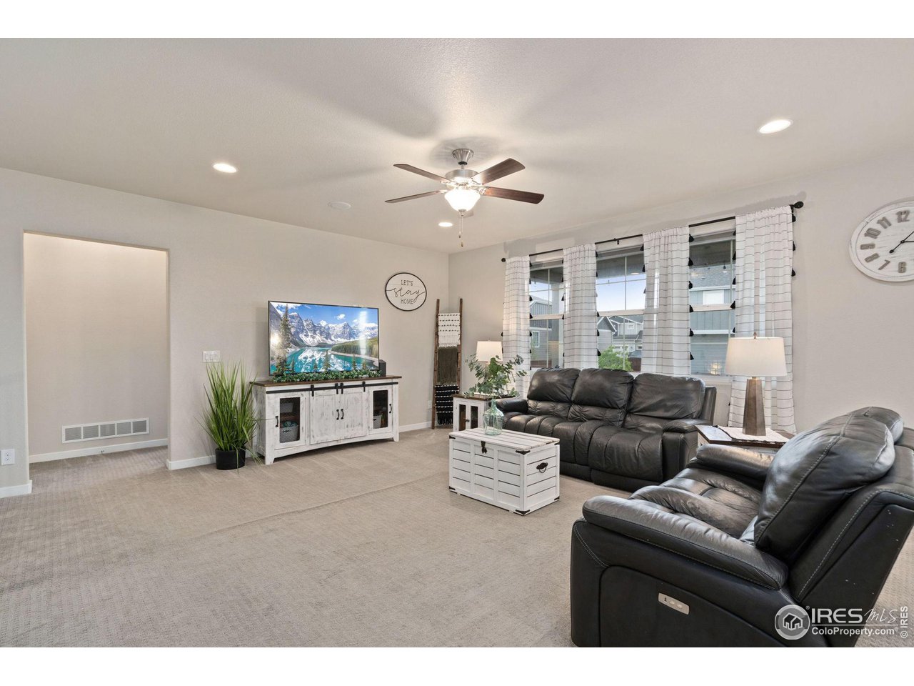 2167 First Light Court Windsor, CO 80550 - Photo 7 of 40 a living room with furniture
