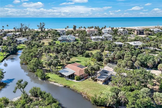 an aerial view of a house with a lake view