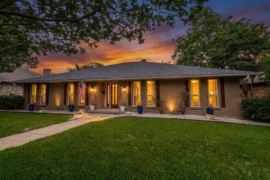 9552 Timberleaf Drive Dallas, TX 75243 - Photo 1 of 32 front view of a house with a yard