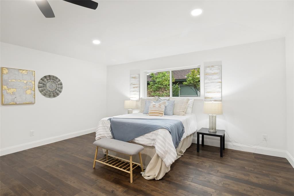 9552 Timberleaf Drive Dallas, TX 75243 - Photo 19 of 32 a bed room with a bed and a chair