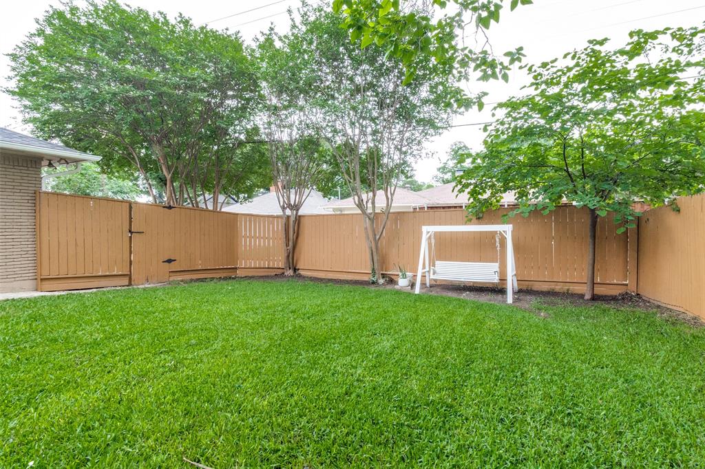 9552 Timberleaf Drive Dallas, TX 75243 - Photo 31 of 32 a white house that has a tree in front of it
